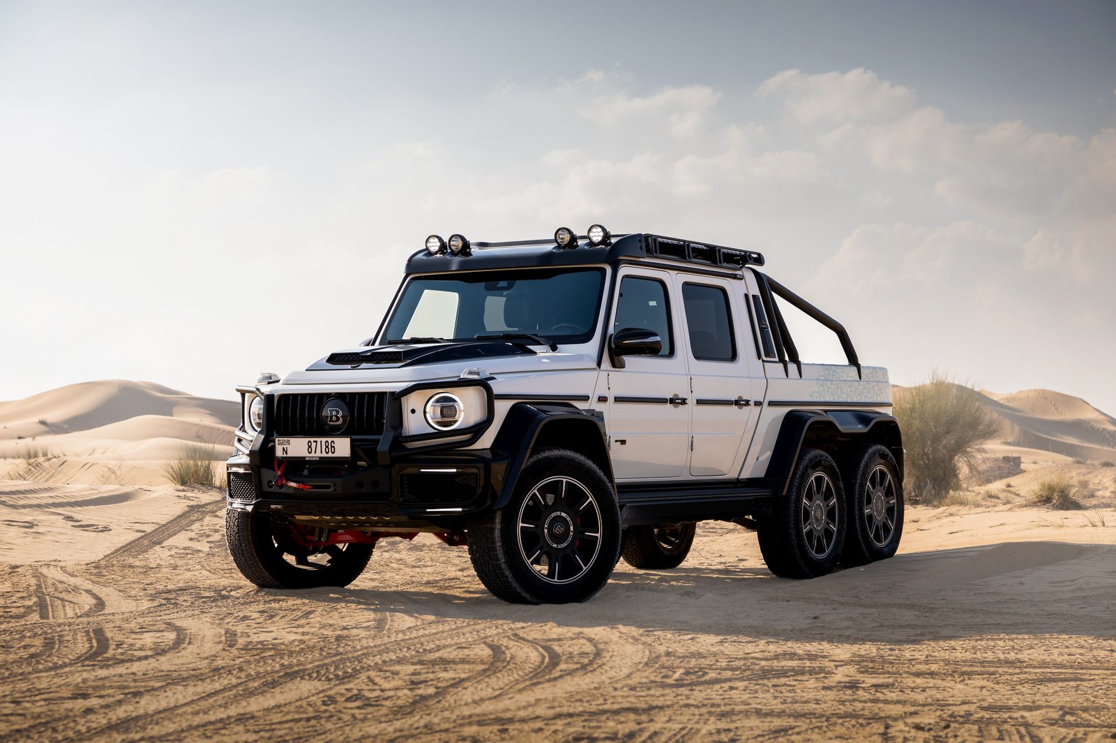 Mercedes-Benz G800 Brabus 6x6 Pickup white front three-quarter view in desert